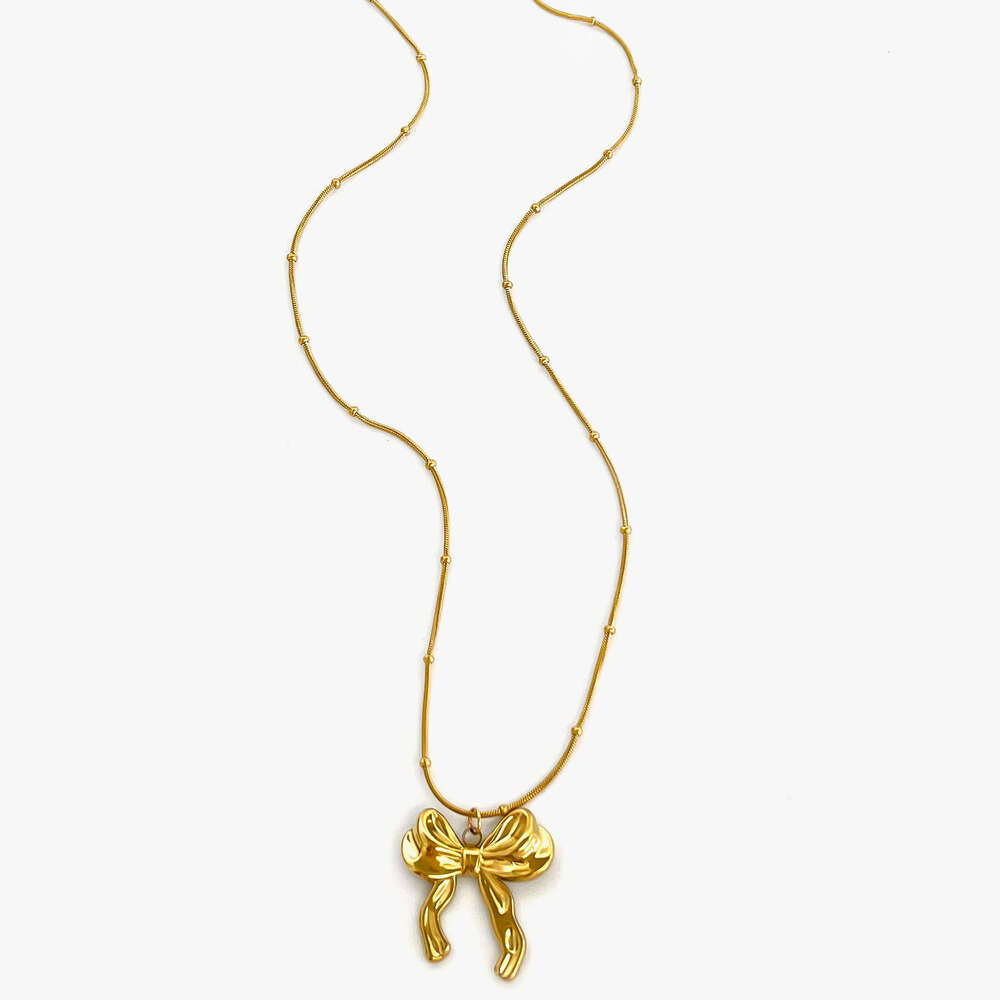 New stainless steel bow pendant necklace with metallic style light fashionable and high-end design for women's fashion