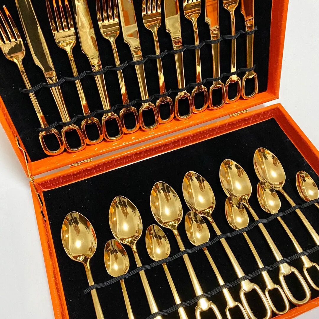 Designer cutlery set with 24 types of knives, forks, and spoons, featuring silver and gold logos as a great gift box