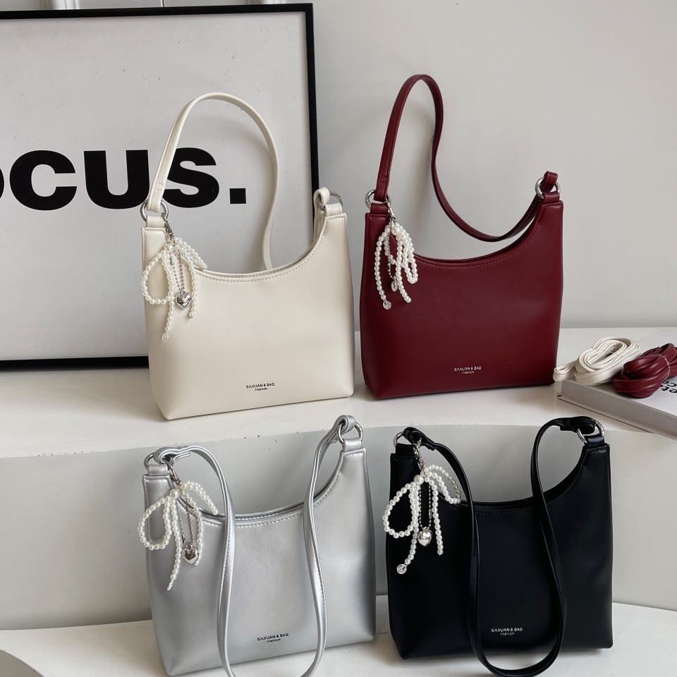 Handheld red female new trendy niche armpit bag, high-end western-style single shoulder crescent bag