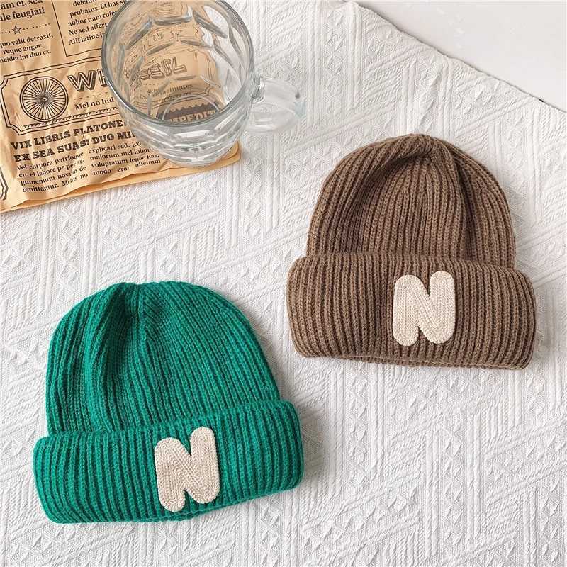 ins Childrens hats Autumn/Winter N letter stick cloth knitted hats for boys and girls cute warm bun wool hat trend LX241018