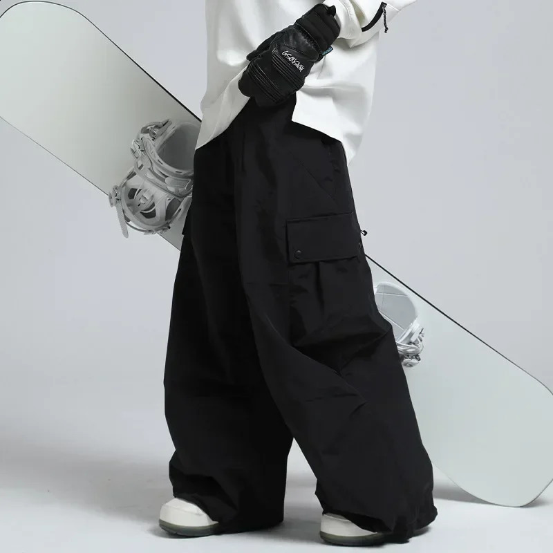 Men Jumpsuit Winter Outdoor Snow Trousers Women Loose Snowboard Wear Waterproof Windproof Skiing Pants Warm Female Ski Clothes 241010