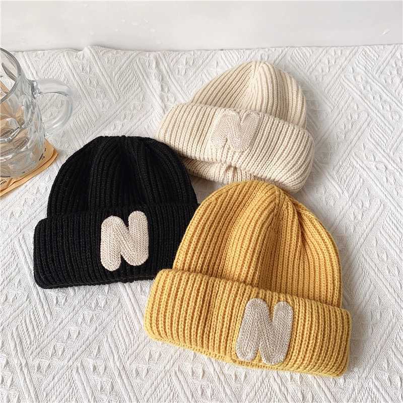 ins Childrens hats Autumn/Winter N letter stick cloth knitted hats for boys and girls cute warm bun wool hat trend LX241018