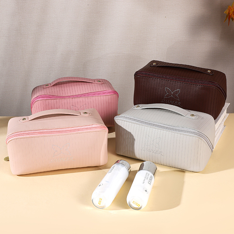 Tote bag new vertical stripes storage cosmetic bag large capacity senior sense of cute face value travel portable organizer bag a from
