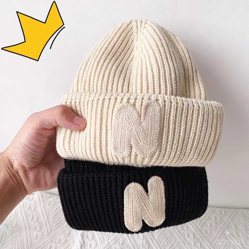 ins Childrens hats Autumn/Winter N letter stick cloth knitted hats for boys and girls cute warm bun wool hat trend LX241018