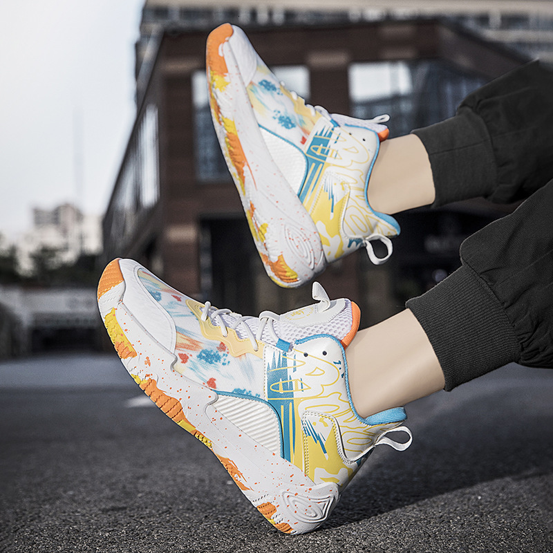 A pair of newly released mandarin duck basketball shoes, men's high top boots, sneakers, and trendy sports shoes for students on concrete ground