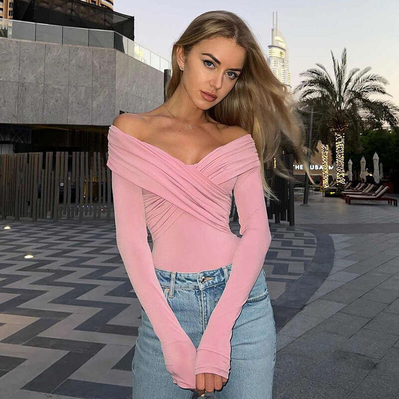 European and American foreign trade autumn and winter women's fashion off shoulder solid color pleated one line cross tight long sleeved bottom t