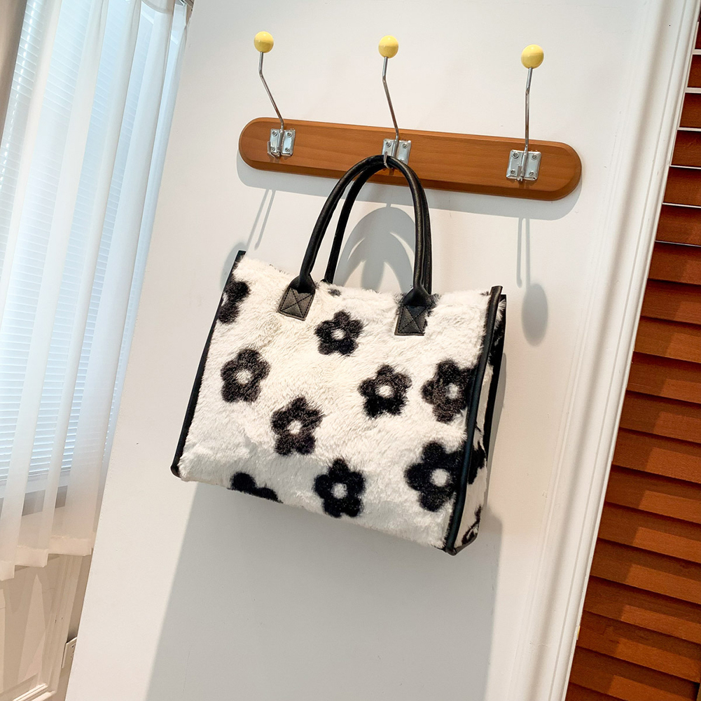 2025 New designer women s furry armpits cow patterned furry shoulders cute handbag Hobo fluffy phone bag Bag winter shopping bag
