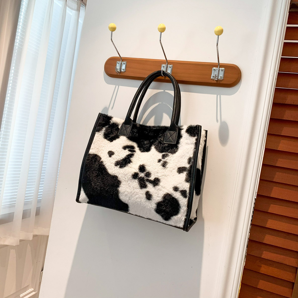 2025 New designer women s furry armpits cow patterned furry shoulders cute handbag Hobo fluffy phone bag Bag winter shopping bag