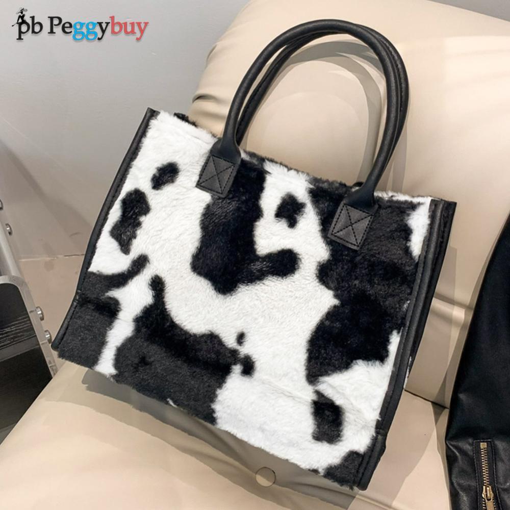 2025 New designer women s furry armpits cow patterned furry shoulders cute handbag Hobo fluffy phone bag Bag winter shopping bag