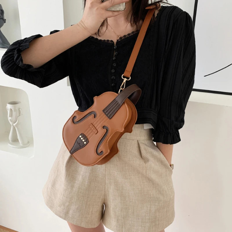 Spring/Summer Fashion Womens Handheld Backpack Selling Network Red Shoulder Ten Font Violin Bag 241023