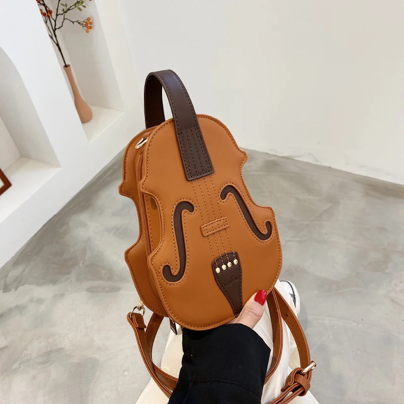 Spring/Summer Fashion Womens Handheld Backpack Selling Network Red Shoulder Ten Font Violin Bag 241023