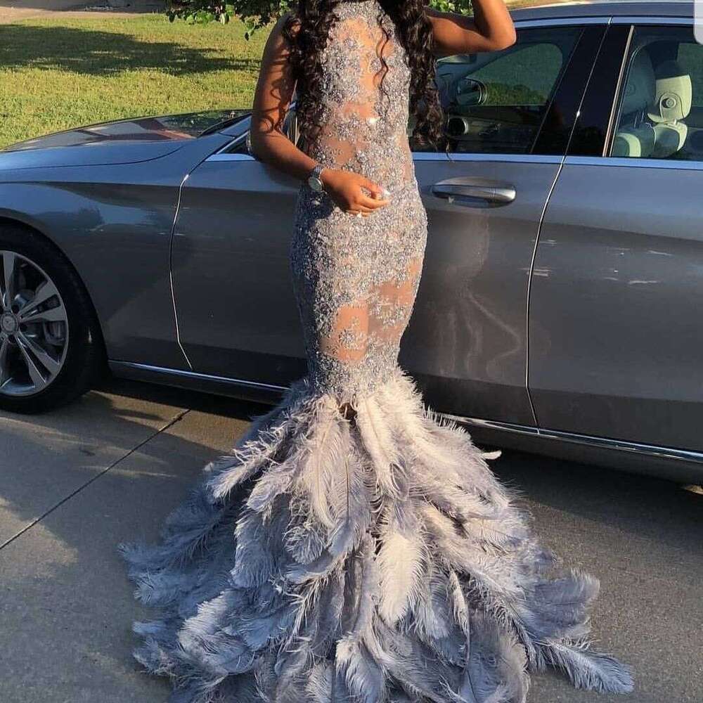 FATAPAESE Full Bodice Rhie Prom Dress V-Cut Necke Open Back with Lower Zipper Closure Feather Train MermaidGown