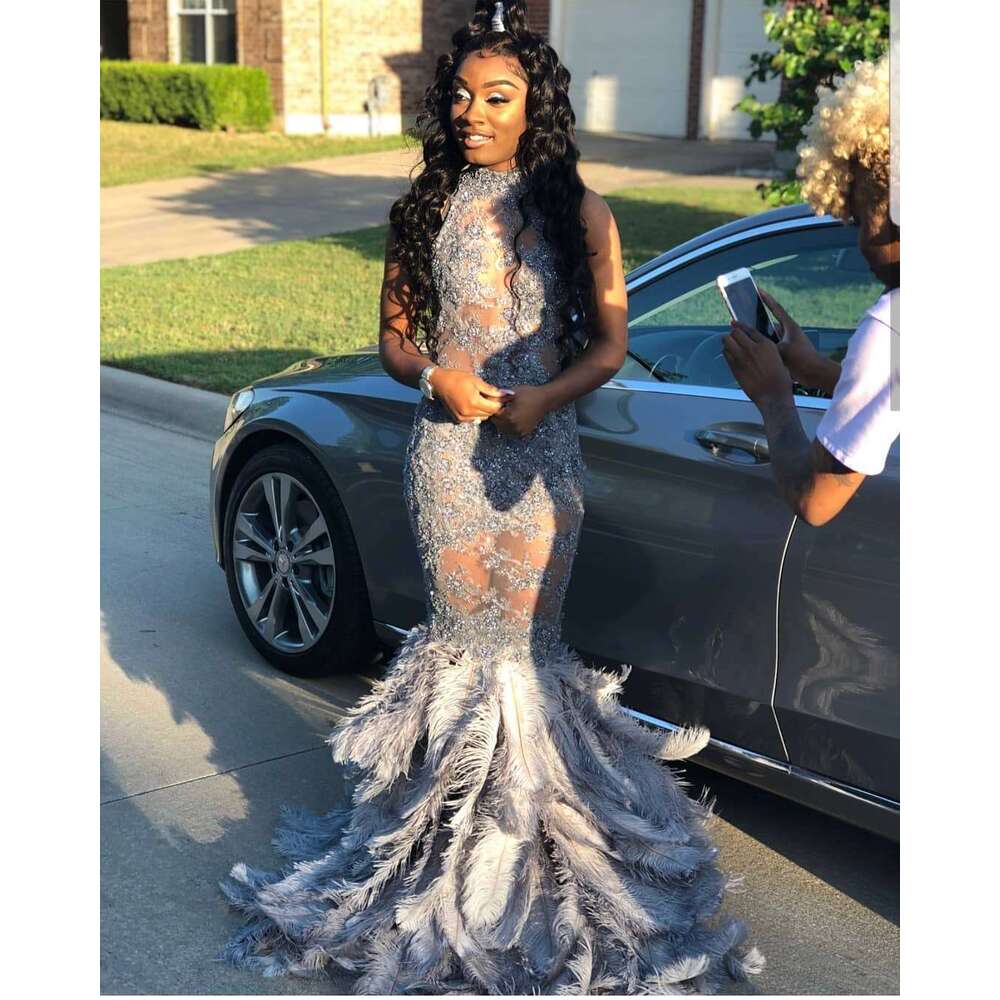 FATAPAESE Full Bodice Rhie Prom Dress V-Cut Necke Open Back with Lower Zipper Closure Feather Train MermaidGown