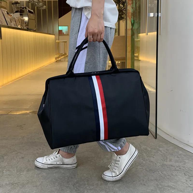 New designer travel bag large women's handbag men's waterproof portable foldable neutral wholesale travel package striped cushion