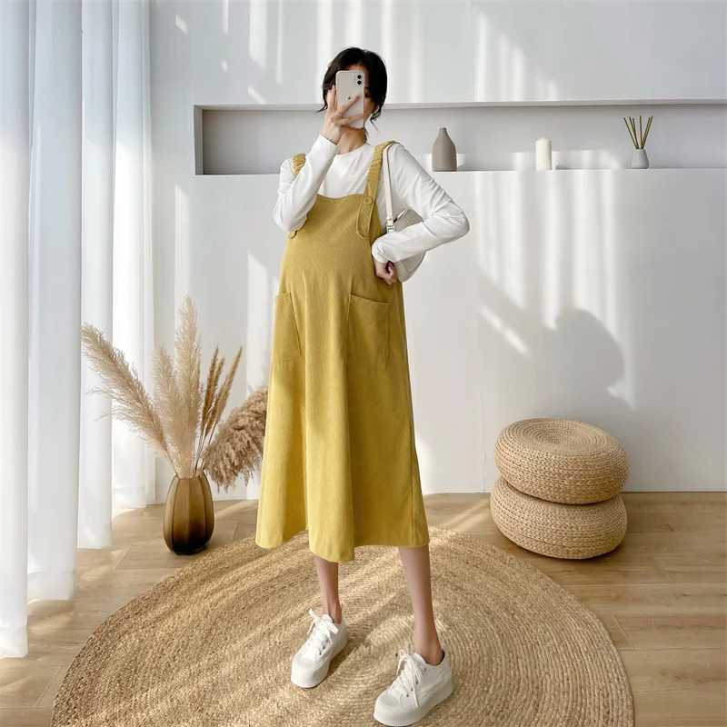 Cotton Corduroy shoulder strap dress with loose knee length and pockets fashionable new winter autumn maternity dress W241026