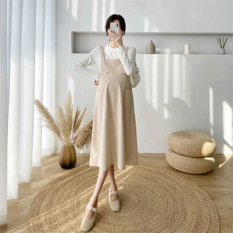 Cotton Corduroy shoulder strap dress with loose knee length and pockets fashionable new winter autumn maternity dress W241026