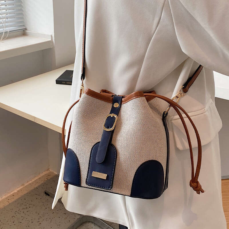 High end canvas contrasting color crossbody bucket for women's spring and summer 2024 new trend, niche design, versatile shoulder bag