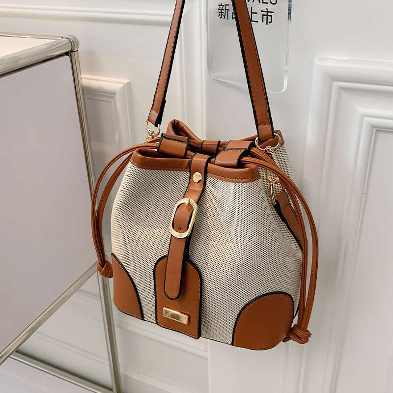 High end canvas contrasting color crossbody bucket for women's spring and summer 2024 new trend, niche design, versatile shoulder bag