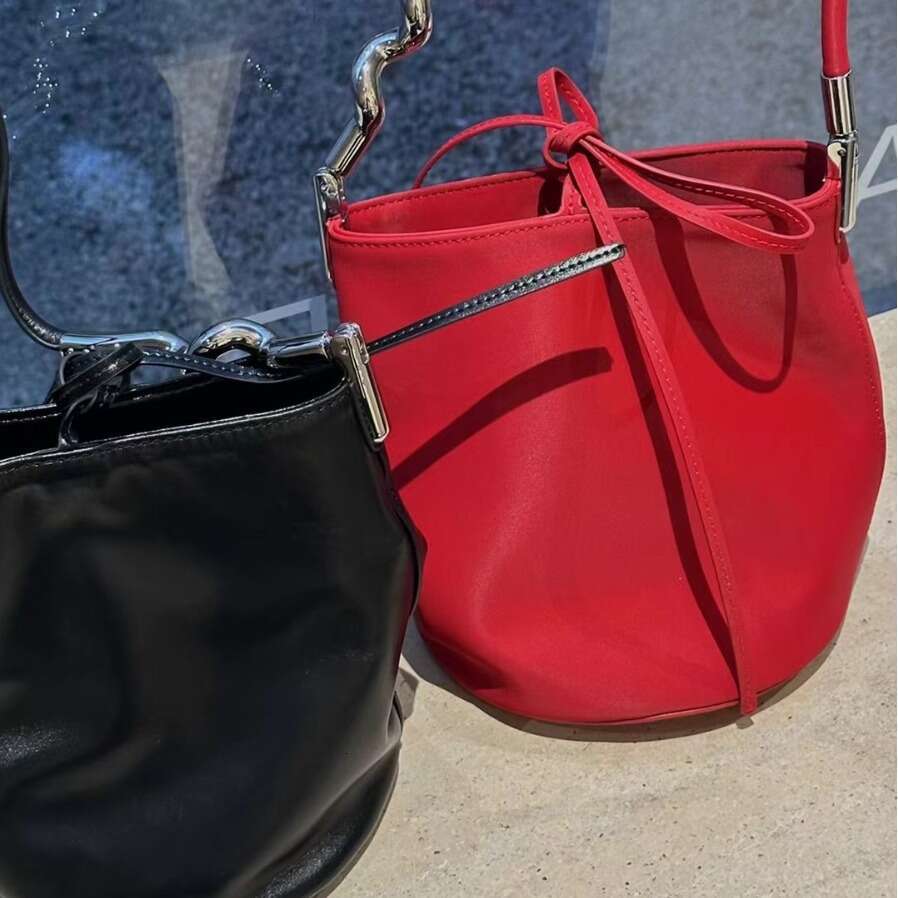 Simple Elegant Irregular Metal Strip Paired With Cowhide Women's Shoulder Bag Underarm Mini Handbag Bucket Purse Hobos