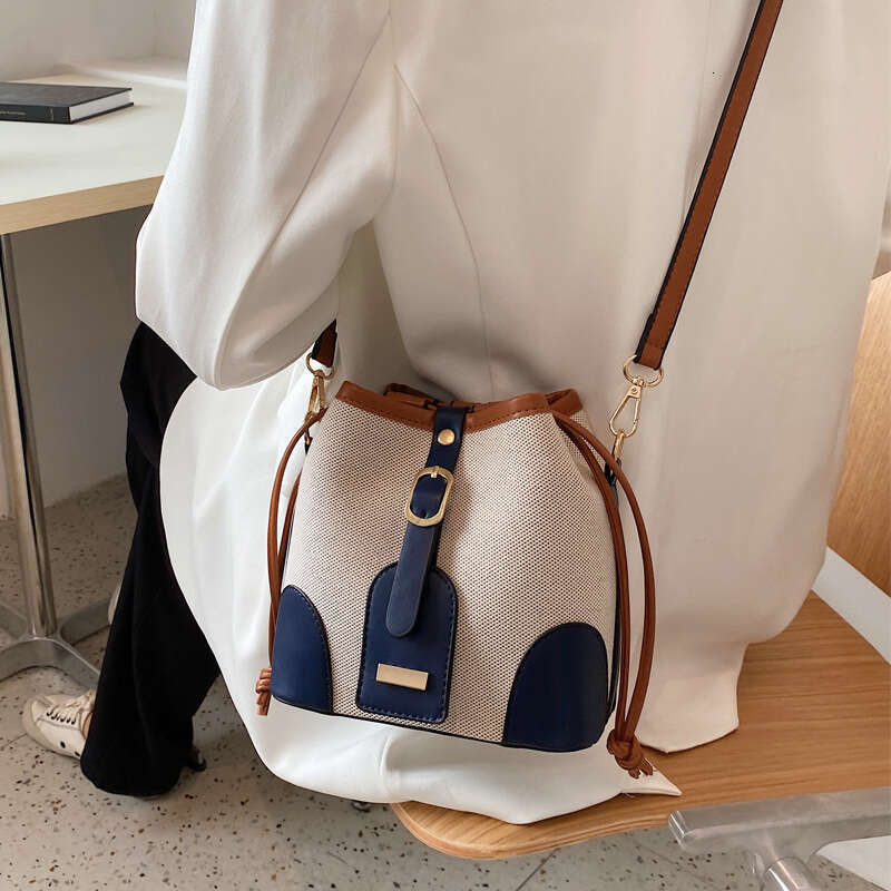 High end canvas contrasting color crossbody bucket for women's spring and summer 2024 new trend, niche design, versatile shoulder bag