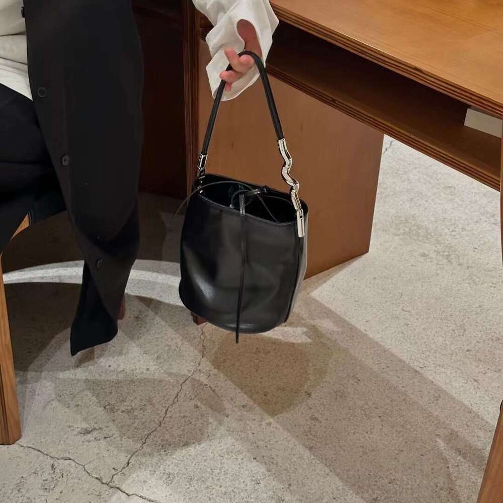 Simple Elegant Irregular Metal Strip Paired With Cowhide Women's Shoulder Bag Underarm Mini Handbag Bucket Purse Hobos