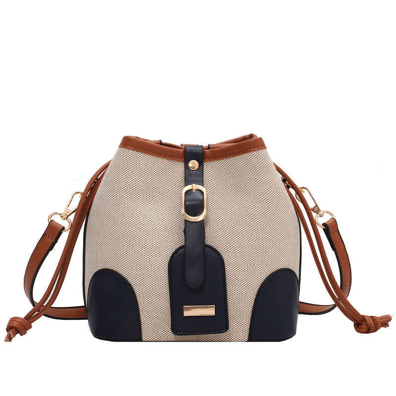 High end canvas contrasting color crossbody bucket for women's spring and summer 2024 new trend, niche design, versatile shoulder bag