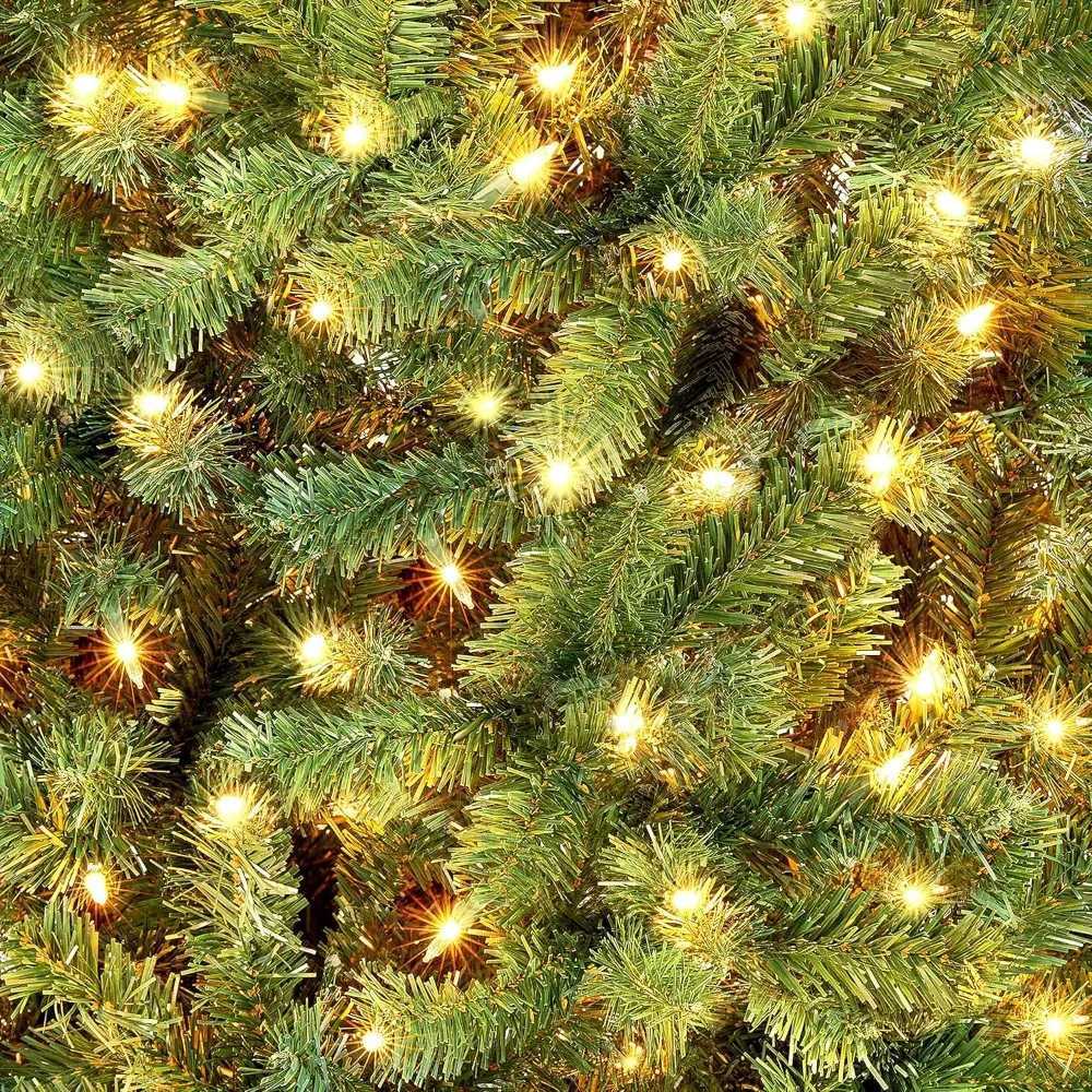 12 foot artificial Christmas tree used for home party decoration with 1500 warm white lights to illuminate the holiday Christmas tree W241029