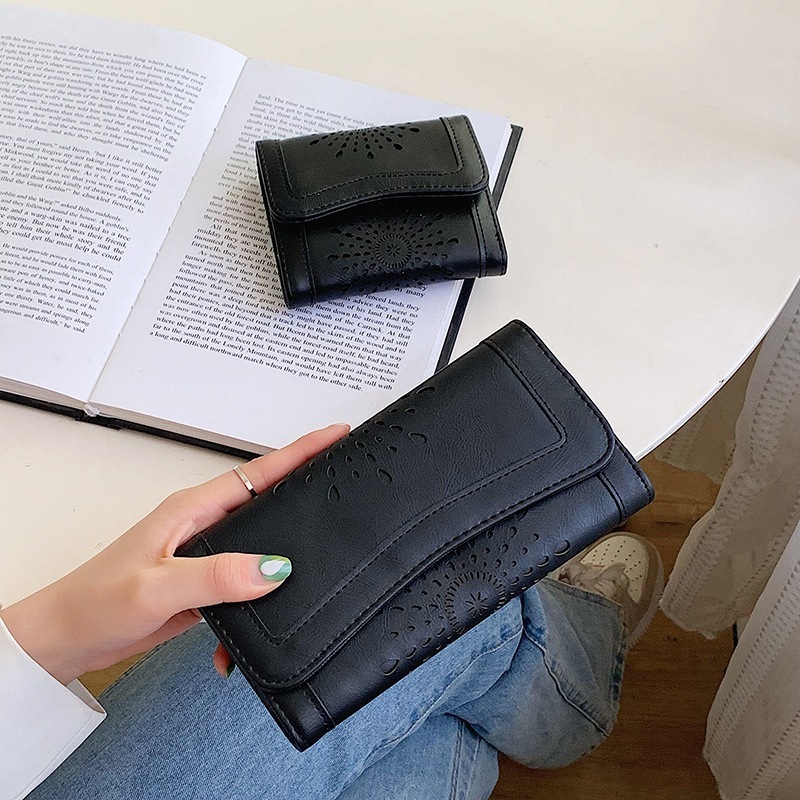 New designer oil wax PU handheld fashionable hollowed out women's mid to long money bag