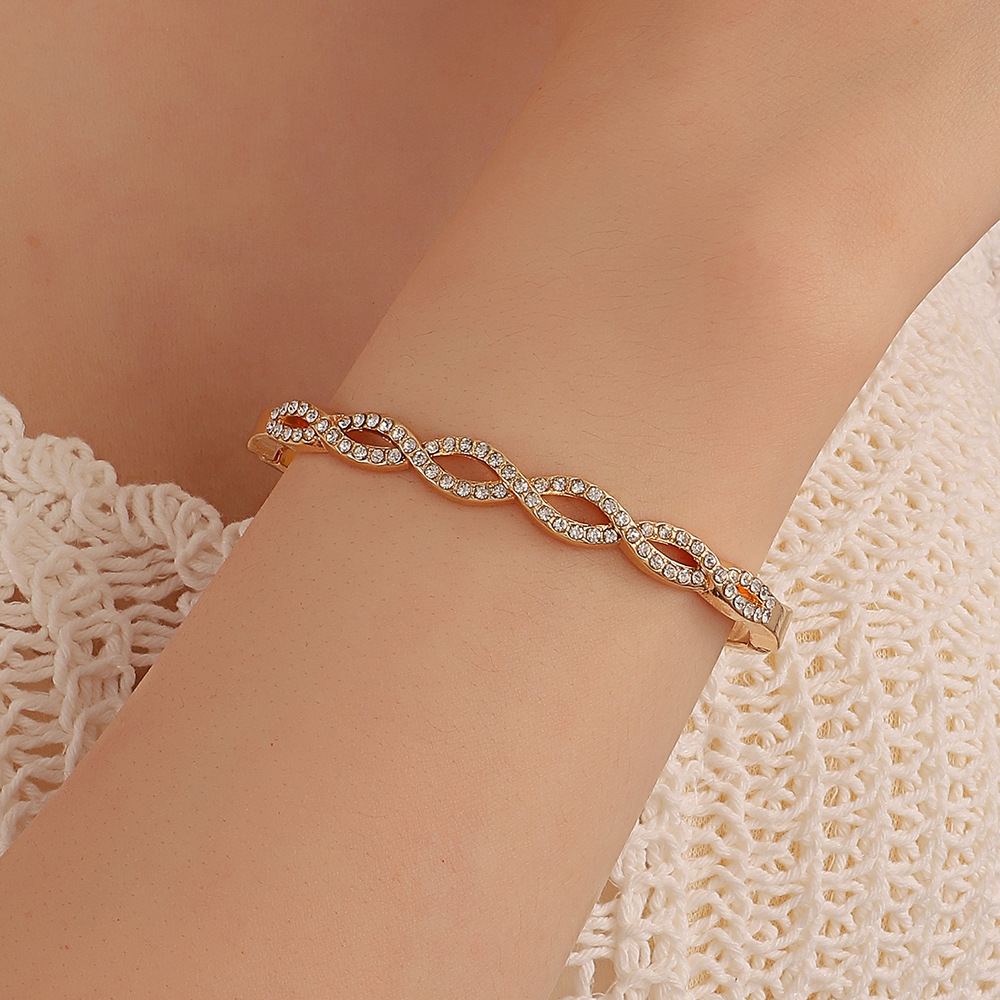 Chic Hollow Design Bracelet Featuring Intricate Cross Stitching & Diamond Detailing