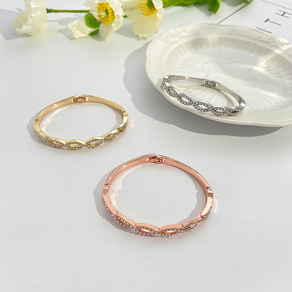 Chic Hollow Design Bracelet Featuring Intricate Cross Stitching & Diamond Detailing