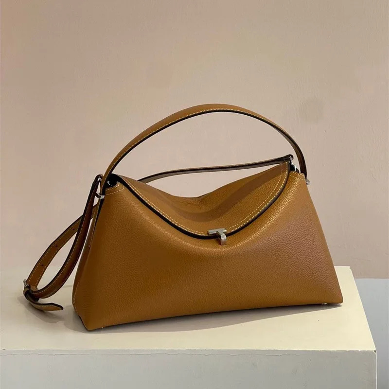 womens cowhide metal lock pebble handbag versatile fashion light niche shoulder bag for women 241030