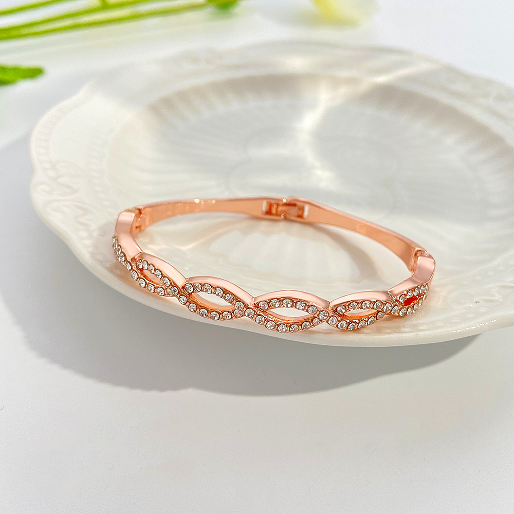 Chic Hollow Design Bracelet Featuring Intricate Cross Stitching & Diamond Detailing