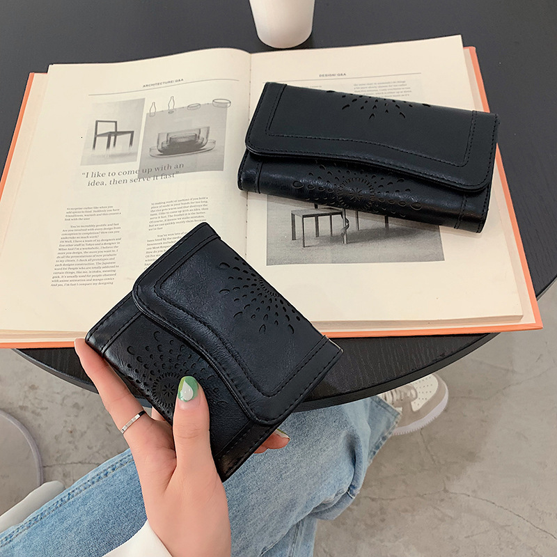 New designer oil wax PU handheld fashionable hollowed out women's mid to long money bag