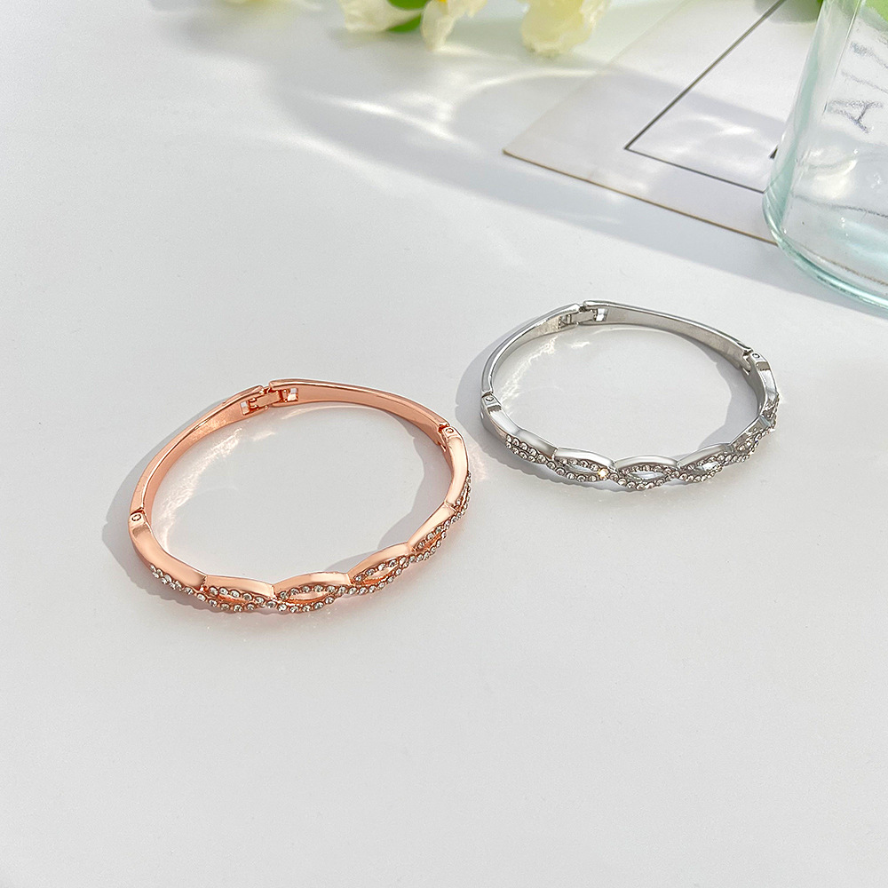 Chic Hollow Design Bracelet Featuring Intricate Cross Stitching & Diamond Detailing