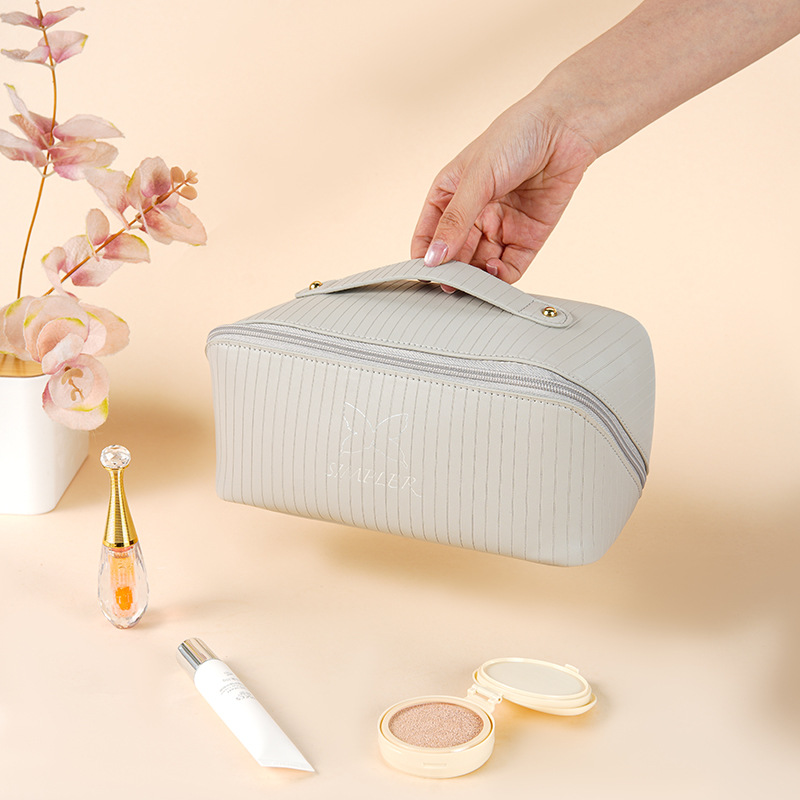 Tote bag new vertical stripes storage cosmetic bag large capacity senior sense of cute face value travel portable