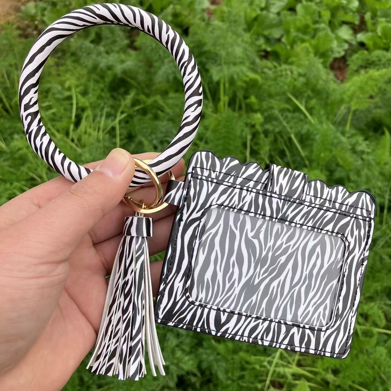 New designer leopard print PU leather tassel bracelet keychain women's card changing handbag ID bag