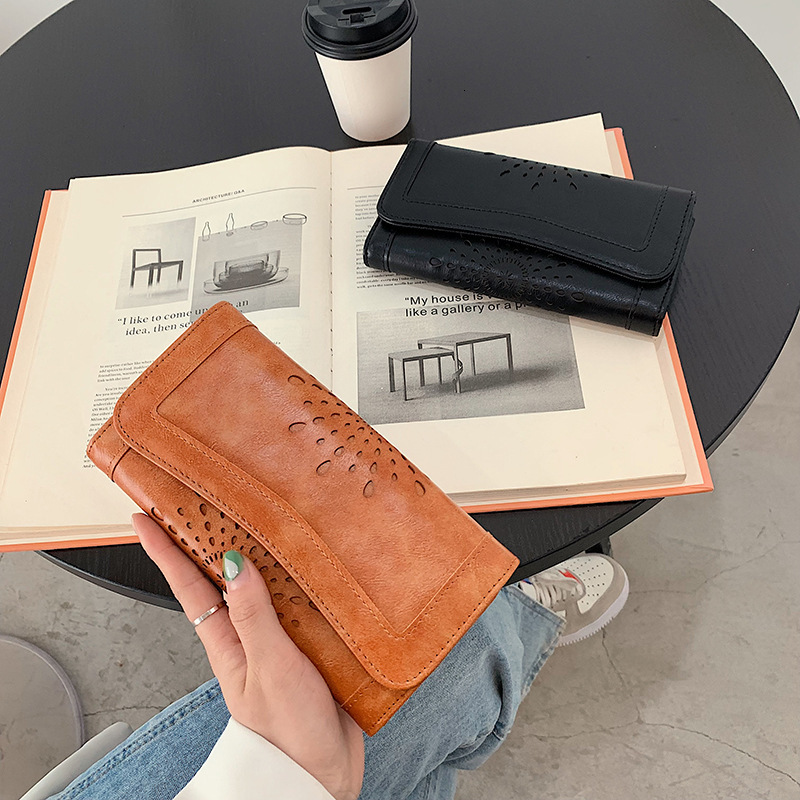 New designer oil wax PU handheld fashionable hollowed out women's mid to long money bag