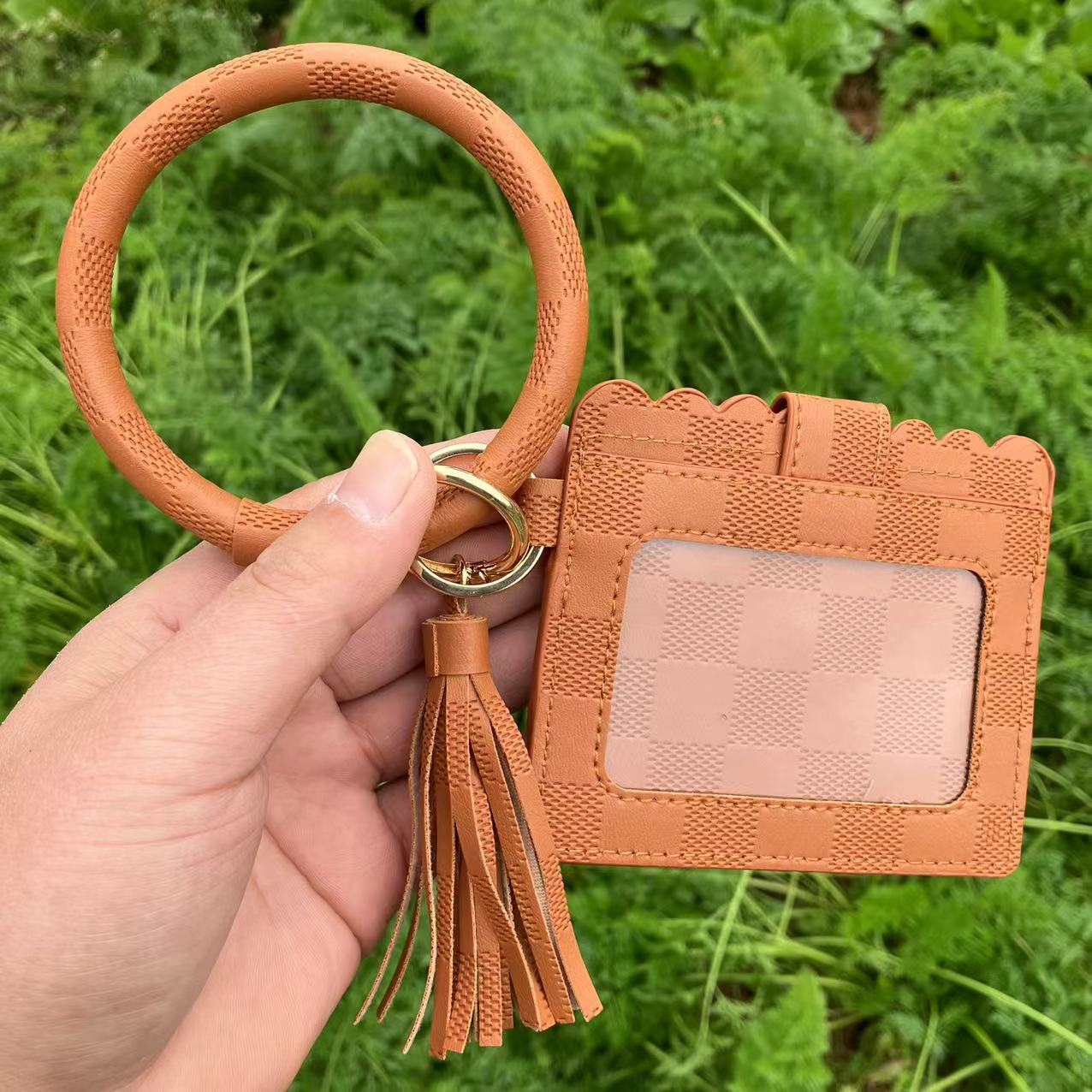 New designer leopard print PU leather tassel bracelet keychain women's card changing handbag ID bag