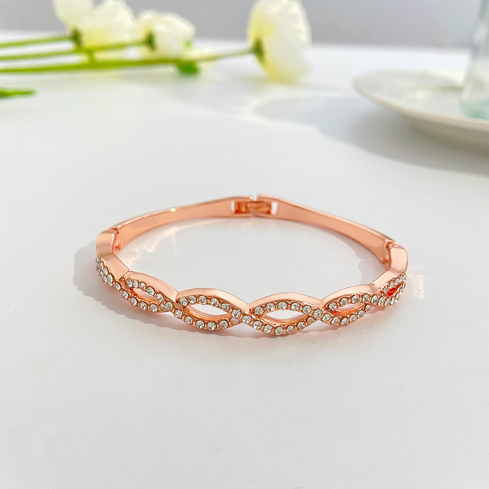 Chic Hollow Design Bracelet Featuring Intricate Cross Stitching & Diamond Detailing