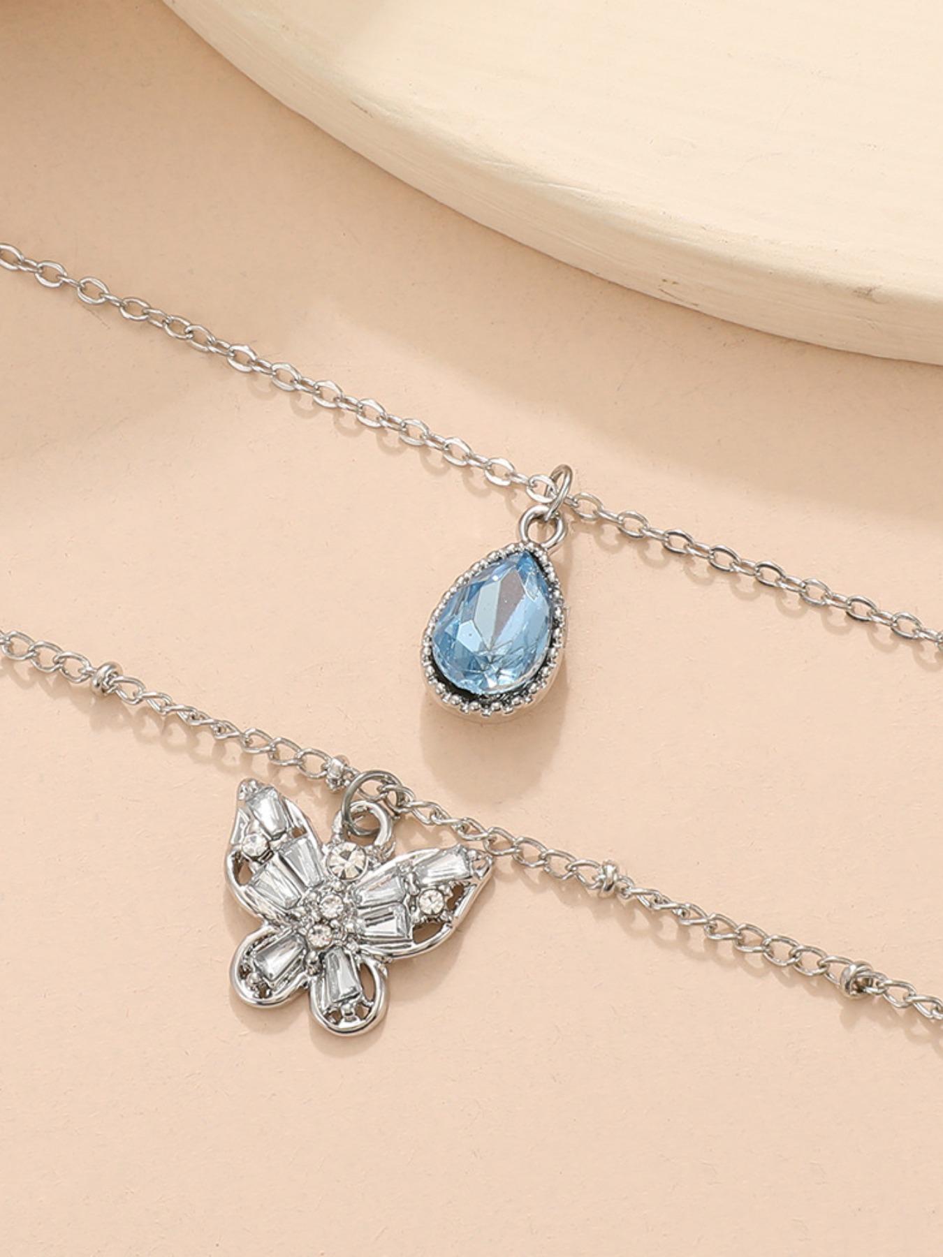 Elegant Multi-Layered Blue Zircon Droplet Butterfly Pendant Necklace for Shoulder Length Wear