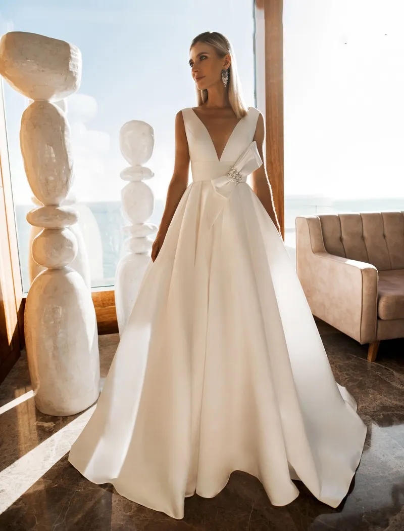 A Line Beach Wedding Dresses V Neck Sleeveless Bow Beads Satin Wedding Dresses Sweep Train Boho Bridal Gowns