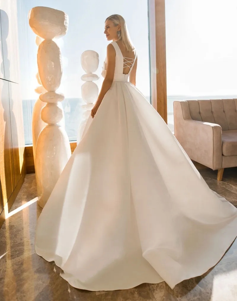 A Line Beach Wedding Dresses V Neck Sleeveless Bow Beads Satin Wedding Dresses Sweep Train Boho Bridal Gowns