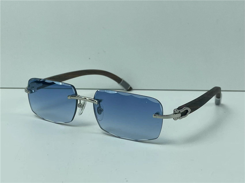 Selling fashion design sunglasses 0117 square cut lens rimless frame spring wooden temples classic simple style uv400 protection glasses
Selling fashion design sunglasses 0117 square cut lens rimless frame spring wooden temples classic simple style uv400 protection glasses