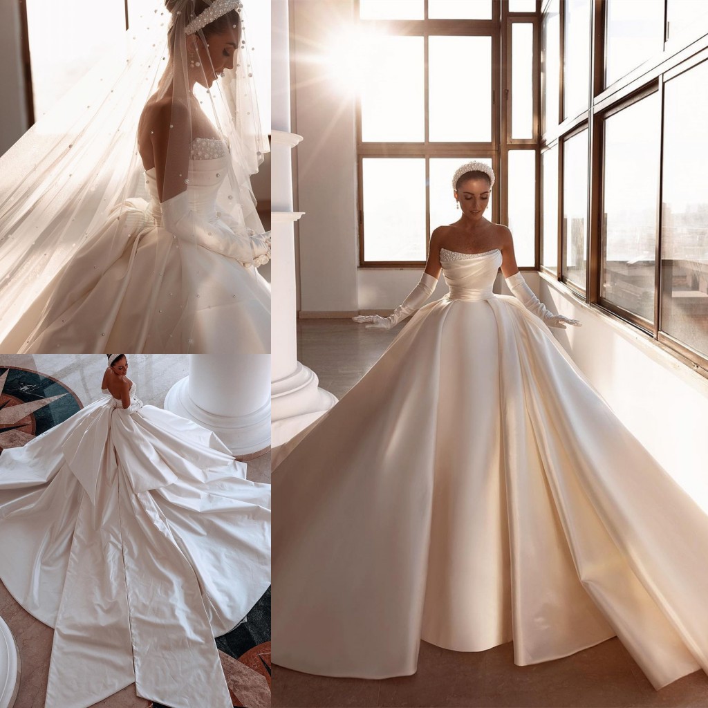 Ivory Royal Satin Dubai Arabic Wedding Dresses Sexy Beads Strapless Backless Ruched Long Train Bridal Gowns With Big Bow