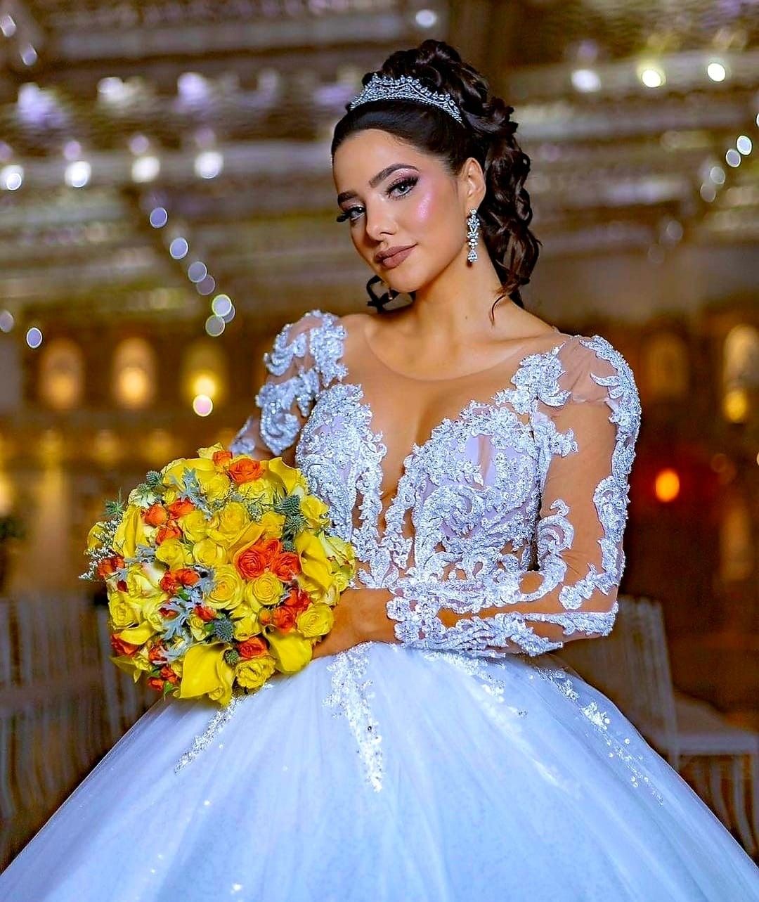 2023 African Ball Gown Wedding Gowns A Line Jewel Neck Illusion Arabia Lace Appliques Crystal Beads Long Sleeves Plus Size Tulle Bridal Party Dresses 