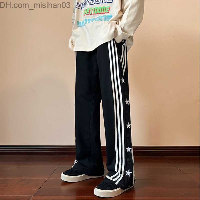 Men's Pants Men's hip-hop pants with side buttons and elastic waist for a loose style jogger Trousers Z230802