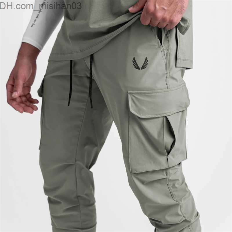 Men's Pants 2022 New Men's Cargo Pants Summer Thin Loose Quick Dry Elastic Tight Running Training Pants Casual Trends Trousers Z230802