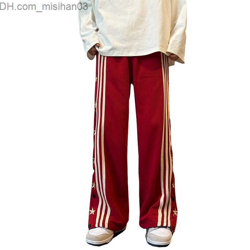 Men's Pants Men's hip-hop pants with side buttons and elastic waist for a loose style jogger Trousers Z230802