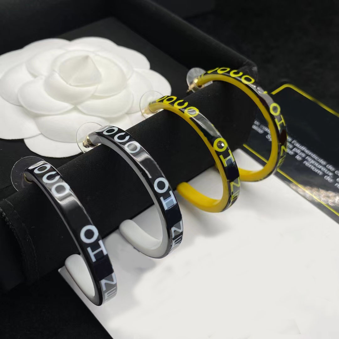 Modern luxury hoop earrings in resin with glossy black enamel finish. Fashion explosion brand designer earrings classic hoop earing. designer jewelry with box
Modern luxury hoop earrings in resin with glossy black enamel finish. Fashion explosion brand designer earrings classic hoop earing. designer jewelry with box