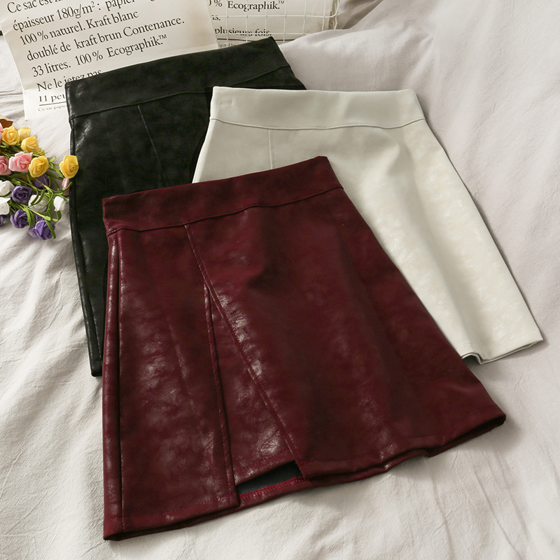 Skirts HELIAR PU Leather Skirts Women A-line Sexy Split Skirts Spring Mini Wide Leg Night Club Mini Skirts For Women Spring 230308